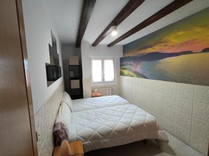 Łóżko lub łóżka w pokoju w obiekcie Agerre Goikoa Agroturismo