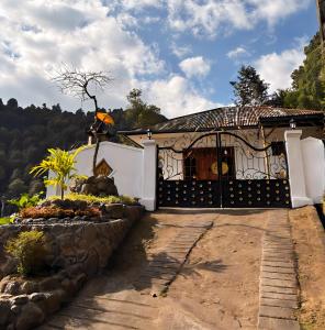 a small house with a gate in front of it at Little Munduk, full private villa in Munduk +15 photos