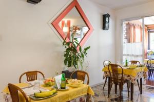 a dining room with a table with bananas on it at Hotel Picador in Rimini