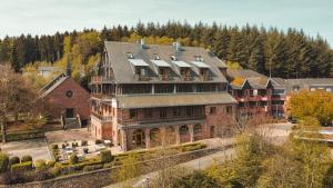 an aerial view of a large brick building at Marienhöh - Hideaway & Spa in Langweiler