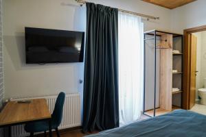 Rúm í herbergi á Peak Hotel Kazbegi