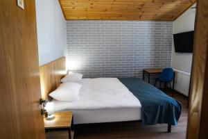 Rúm í herbergi á Peak Hotel Kazbegi