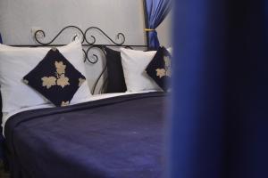 Postel nebo postele na pokoji v ubytování Riad Hôtel Belleville Marrakech