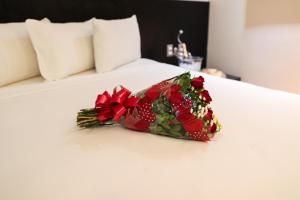 Postel nebo postele na pokoji v ubytování Cassino Tower Savassi - Próximo a FIEMG