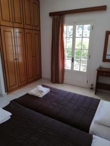 Postel nebo postele na pokoji v ubytování Lemonia Apartment