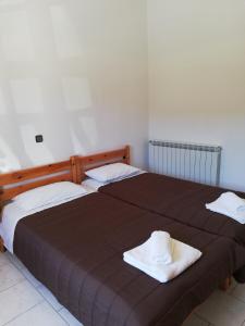 Postel nebo postele na pokoji v ubytování Lemonia Apartment