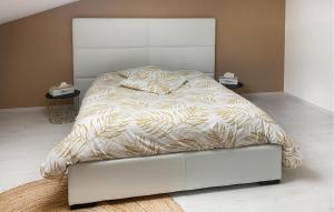 a bedroom with a bed with a white bed frame at Jolie Maison in Pornic +7 photos