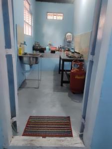 a large room with a sink and a fire hydrant at Arapura Veedu Heritage Homestay in Kizhillam