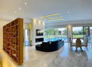 a living room with a couch and a table at Hala Luxury Domain in Marrakech