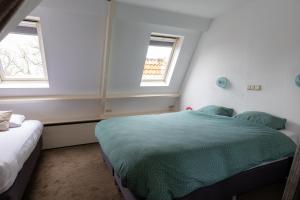 Postel nebo postele na pokoji v ubytování Hotel de Magneet