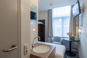 TV a/nebo společenská místnost v ubytování Hotel de Magneet