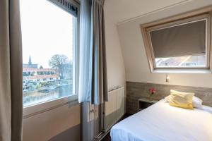 Postel nebo postele na pokoji v ubytování Hotel de Magneet