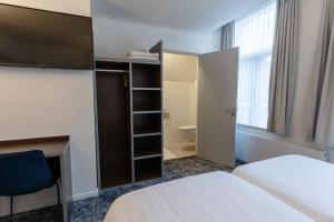 Postel nebo postele na pokoji v ubytování Hotel de Magneet