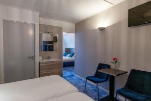 Postel nebo postele na pokoji v ubytování Hotel de Magneet