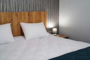 Rúm í herbergi á Peak Hotel Kazbegi
