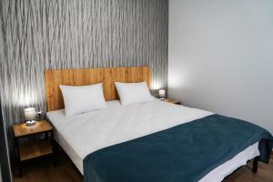 Rúm í herbergi á Peak Hotel Kazbegi