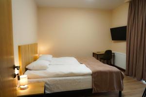 Rúm í herbergi á Peak Hotel Kazbegi