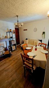 a living room with a table and a couch at Splendide T2 Piana in Piana