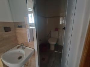 a bathroom with a sink and a toilet at Future in Taghazout +12 photos