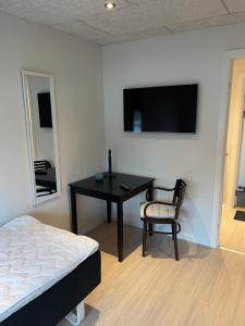 TV a/nebo společenská místnost v ubytování Billund Mini Hostel room 5