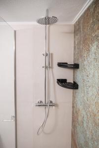 a shower in a bathroom with a glass door at Christie's Luxury Apartments in Preveza +32 photos