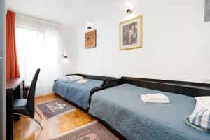 Postel nebo postele na pokoji v ubytování Apartment Suite Theater