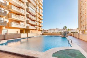a swimming pool in the middle of a building at Apartamentos Turisticos Isla Grosa in La Manga del Mar Menor