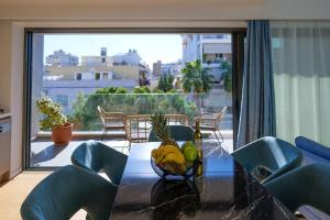 a dining room table with a bowl of fruit on it at Luxurious Athens Residence in Athens