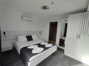 Postel nebo postele na pokoji v ubytování Paddys Villa + 24 fotografií