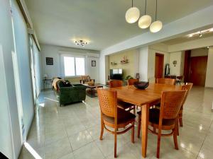a dining room and living room with a table and chairs at Comfort Stay in Nicosia - Aglantzia RIK in Nicosia +10 photos