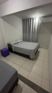 a bedroom with two beds in a room at Residencial Maldonado Eckert - APTO 199 E - Praia Grande in São Francisco do Sul