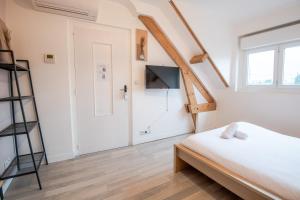 Giường trong phòng chung tại Le Pic-Paris +67 ảnh