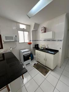 Køkken eller tekøkken på Loft 705 Pitangueiras Guarujá + 20 billeder