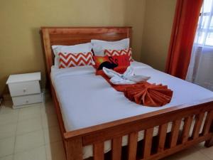 Ένα ή περισσότερα κρεβάτια σε δωμάτιο στο Floral