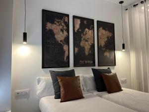 a living room with a couch with a map on the wall at Apartments Vent de Vela in Valencia