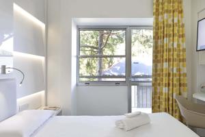Кровать или кровати в номере B&B Hotel Savona