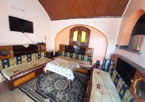 TV a/nebo společenská místnost v ubytování Malika nubian house