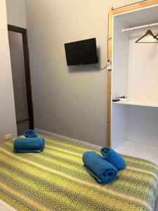 a room with two blue towels on the floor at "Marcello's Home" in Catania +7 photos