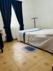 Postel nebo postele na pokoji v ubytování Meeyan Ella Rest