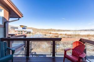a balcony with two chairs and a view of the desert at Mountain Retreat Hot Tub Views,Near Shops in Park City