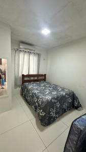 Postel nebo postele na pokoji v ubytování Casa Litorâneo 6