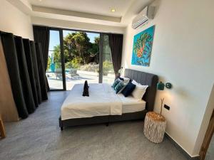 Postel nebo postele na pokoji v ubytování Villa CHARLOTTE - SEAVIEW -4 Bedrooms