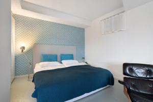 Postel nebo postele na pokoji v ubytování Modernes Apartment Ammersee