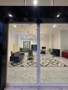 a large living room with a large glass window at ICC Luxury Suites Ipoh City Centre By Landmark in Ipoh +48 photos