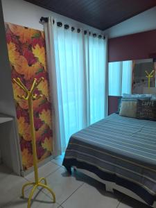 Giường trong phòng chung tại Espaço Lux Betim