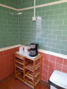 a coffee maker on a table in a bathroom at sark guest house in Barnstaple +56 photos