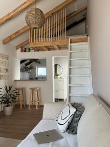 a living room with a couch with a laptop on it at Guest house TAK in Cetinje