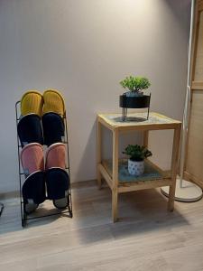 a room with two chairs and a table with a plant at With US 2 in Seoul +44 photos