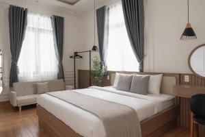 Ένα ή περισσότερα κρεβάτια σε δωμάτιο στο The Palette Dalat 2