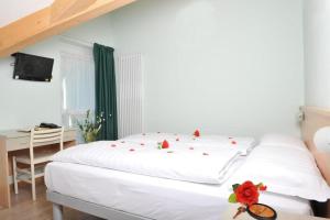 Postel nebo postele na pokoji v ubytování Hotel Garnì Maria